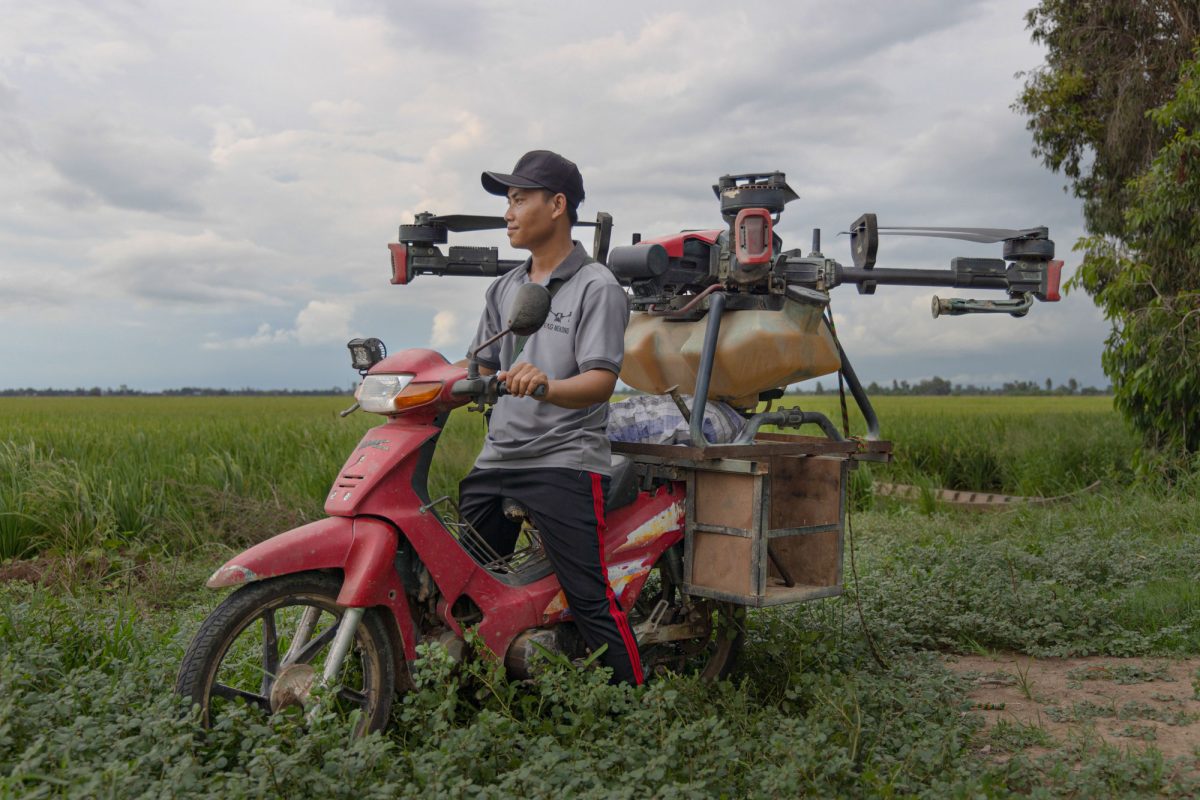 To Van Hoang transporting his drone by motorcycle. 