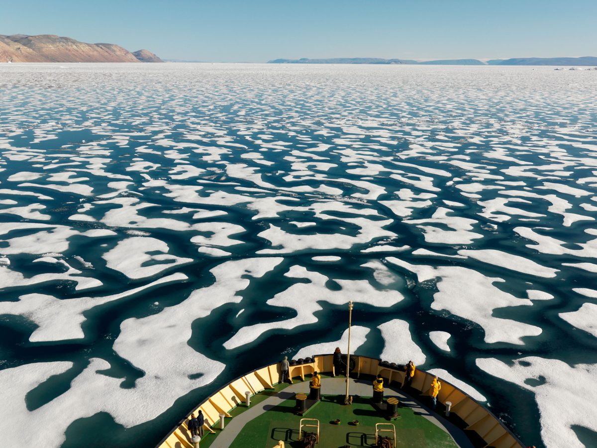 Broken one year ice off the coast of Ellesmere Island, seen from prow of boat, Nunavut, Canada
