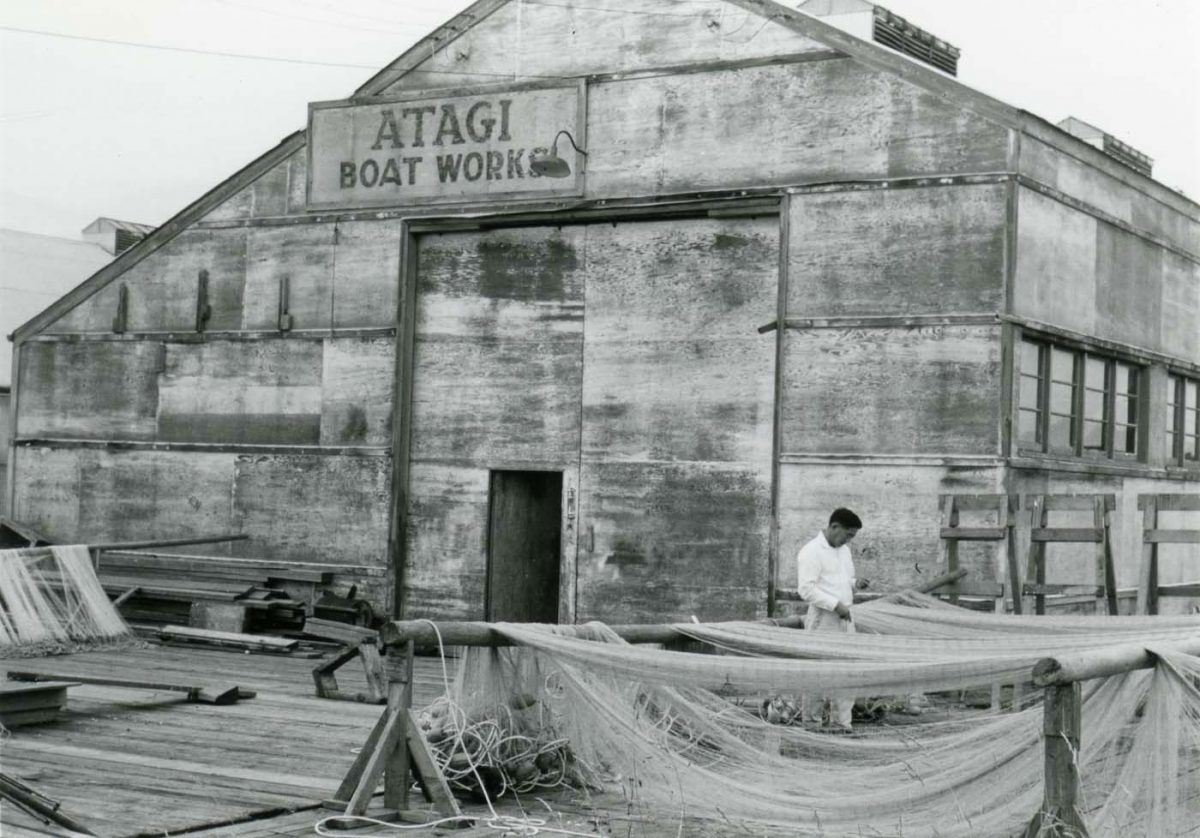 Satoshi mending fishing nets in 1966. Photo courtesy of the City of Richmond Archives
