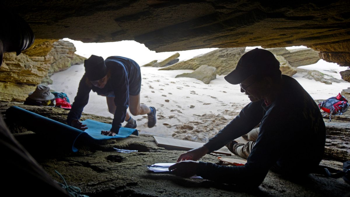Charles Helm, right, and his wife, Linda, work in the cave on the South African coast where they found ancient footprints