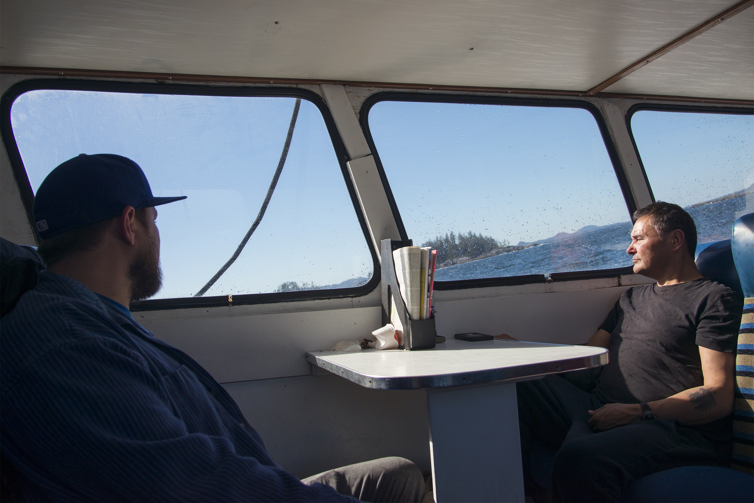 With the boat rocking and the horizon pitching, William Beynon of the Metlakatla Stewardship Society concentrates on the central coast scenery. Photo by Shanna Baker