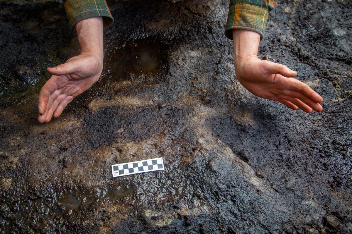 Archaeologist Duncan McLaren shows the footprints his team found on Calvert Island