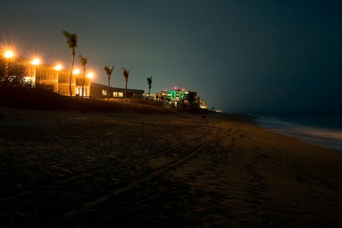 bright lights on building next to beach