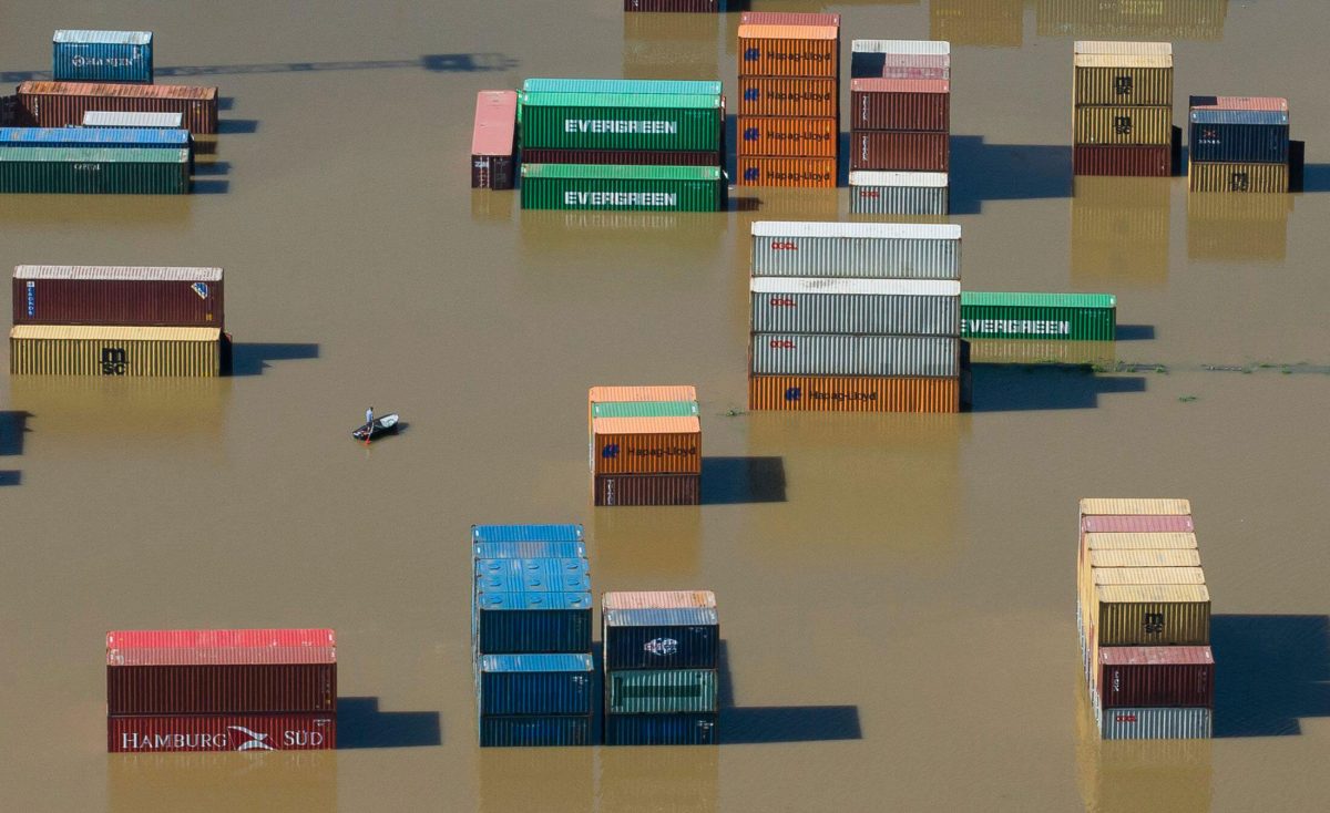 Shipping containers stranded in floodwaters at the harbor in Riesa, Germany
