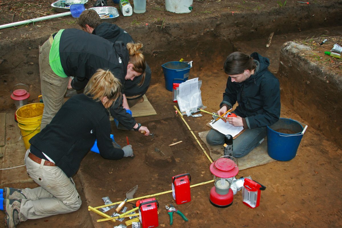 A research team examines a burial site on St. Catherines Island, Georgia