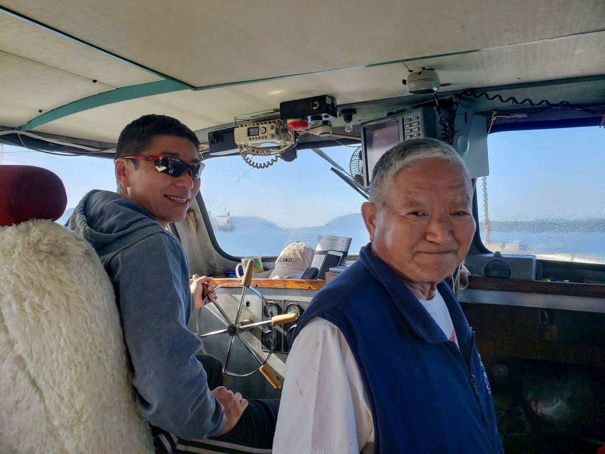 Dereck Hamada and Satoshi out at sea on the Magic Maker. Photo courtesy of the Hamada family