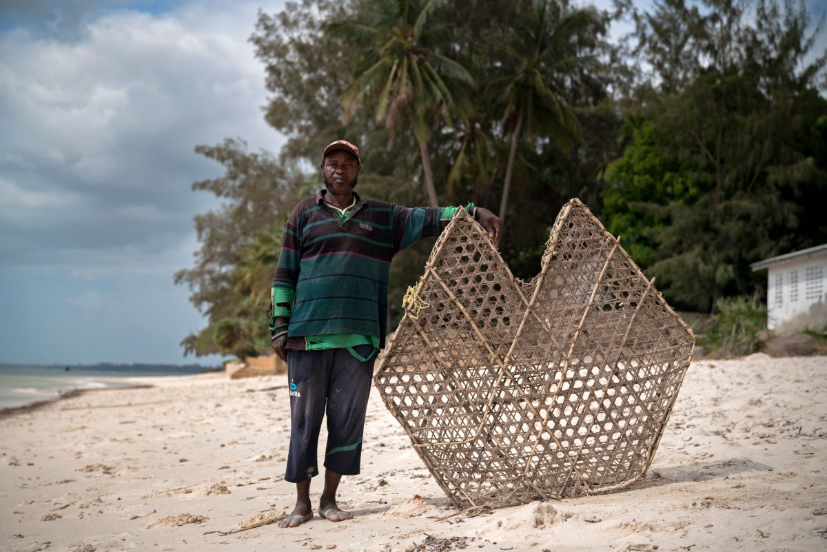 Kenyan fisher with traditional basket