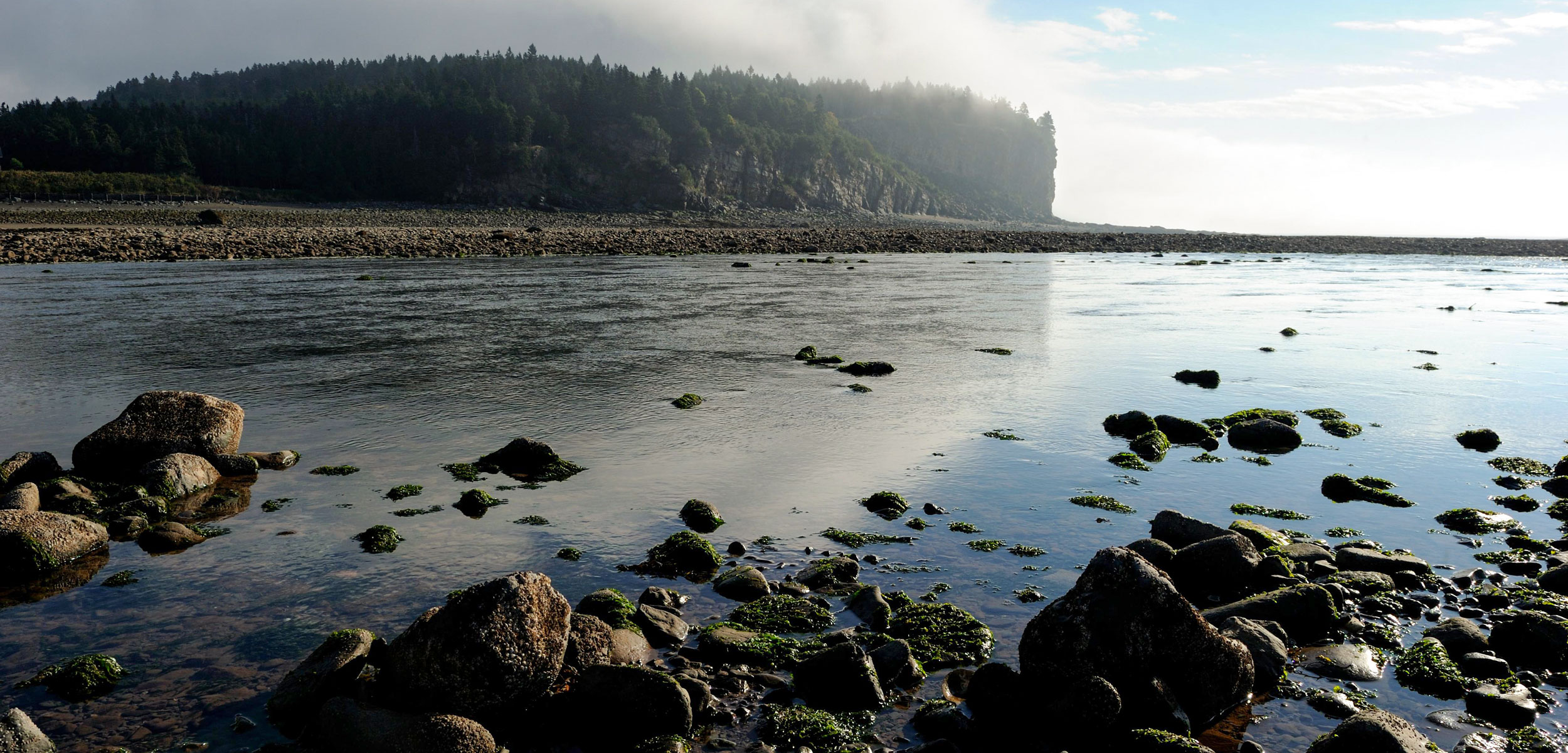 Upper Salmon river at outgoing tide and sunrise, Bay of Fundy