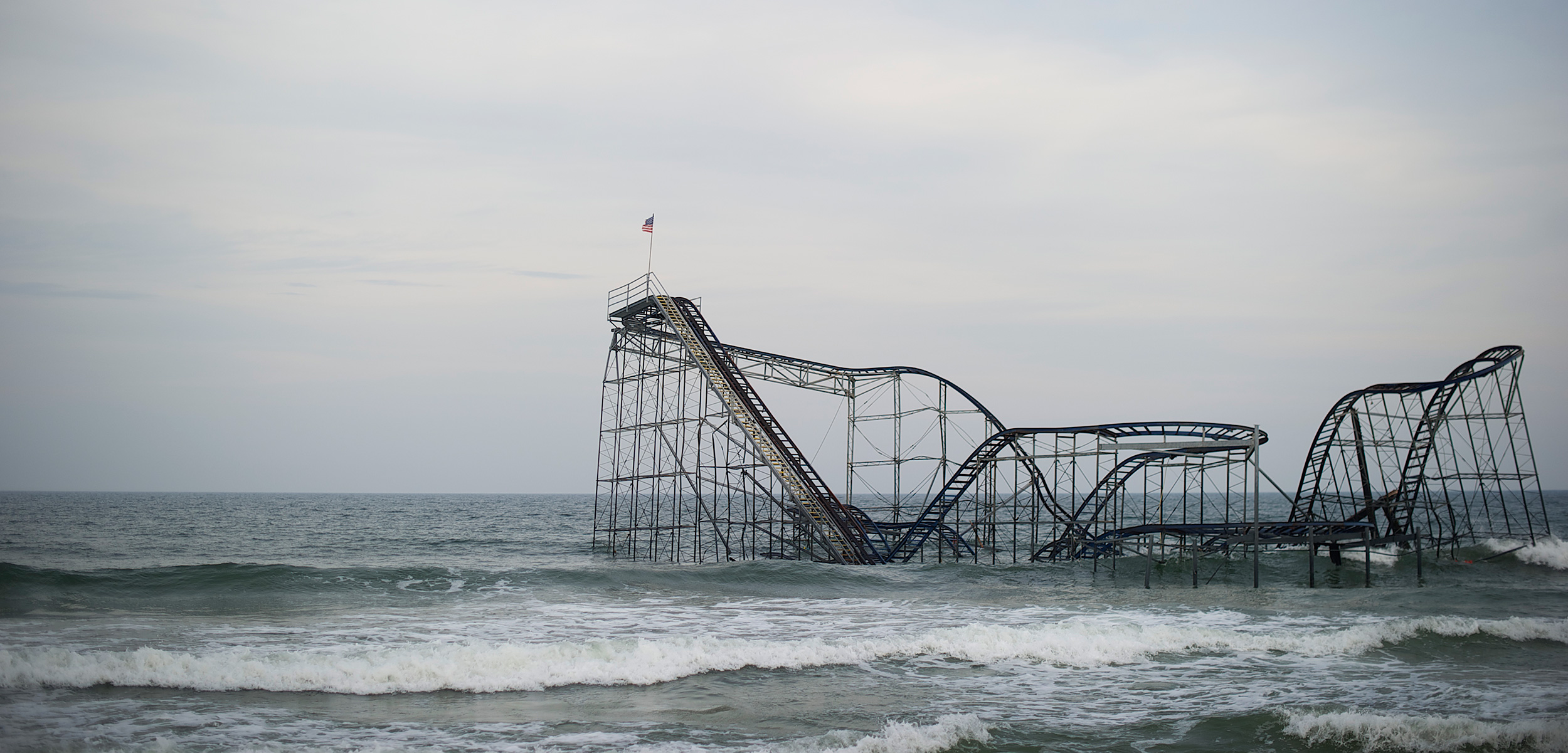 In 2012, Superstorm Sandy hit the New Jersey coastline, smashing homes, businesses, the boardwalk—and Seaside Heights’ iconic roller coaster, an enduring symbol of the storm’s ferocity. Photo by Mark Makela/Corbis