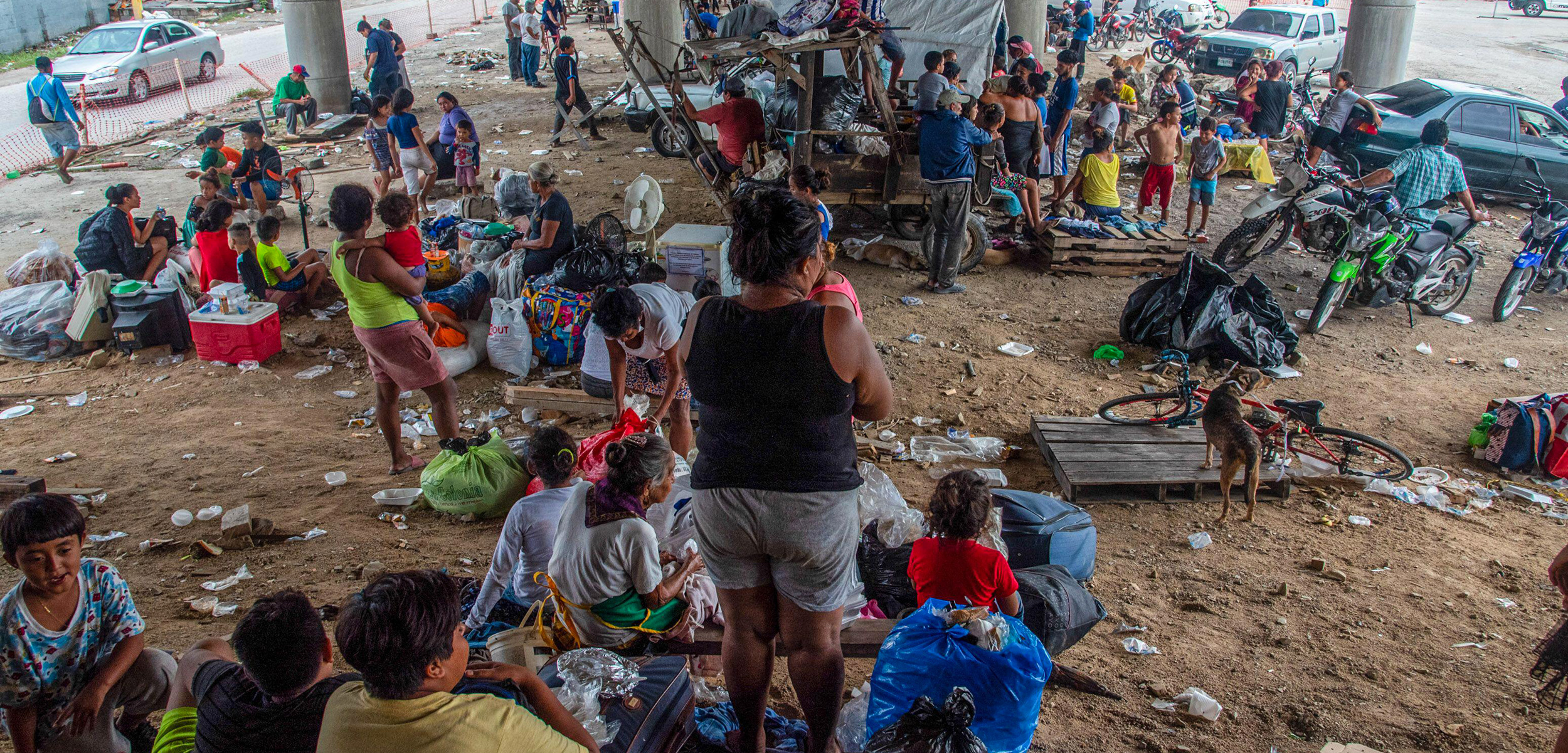 People in a makeshift camp underneath an underpass in Honduras after Hurricane Eta