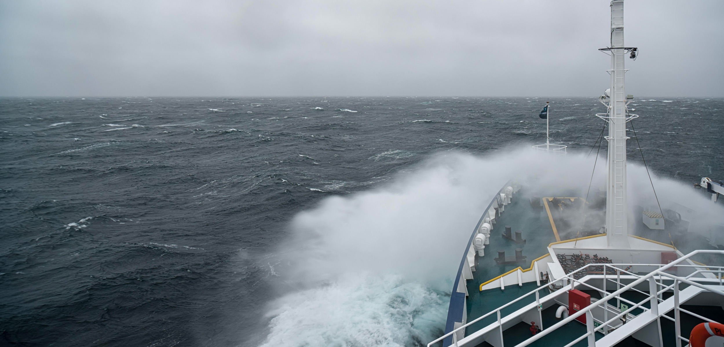 Ship cruising in storm and heavy seas