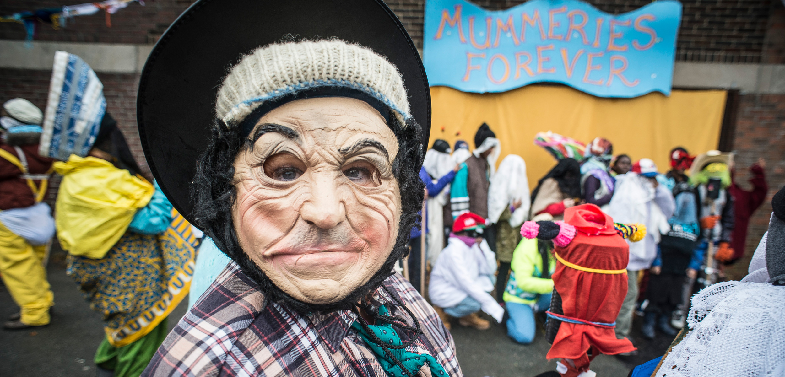 Mummers disguise every aspect of themselves—their faces, ears, hair, hands, gait, body shape, and, often, their gender. Photo courtesy of the Mummers Festival