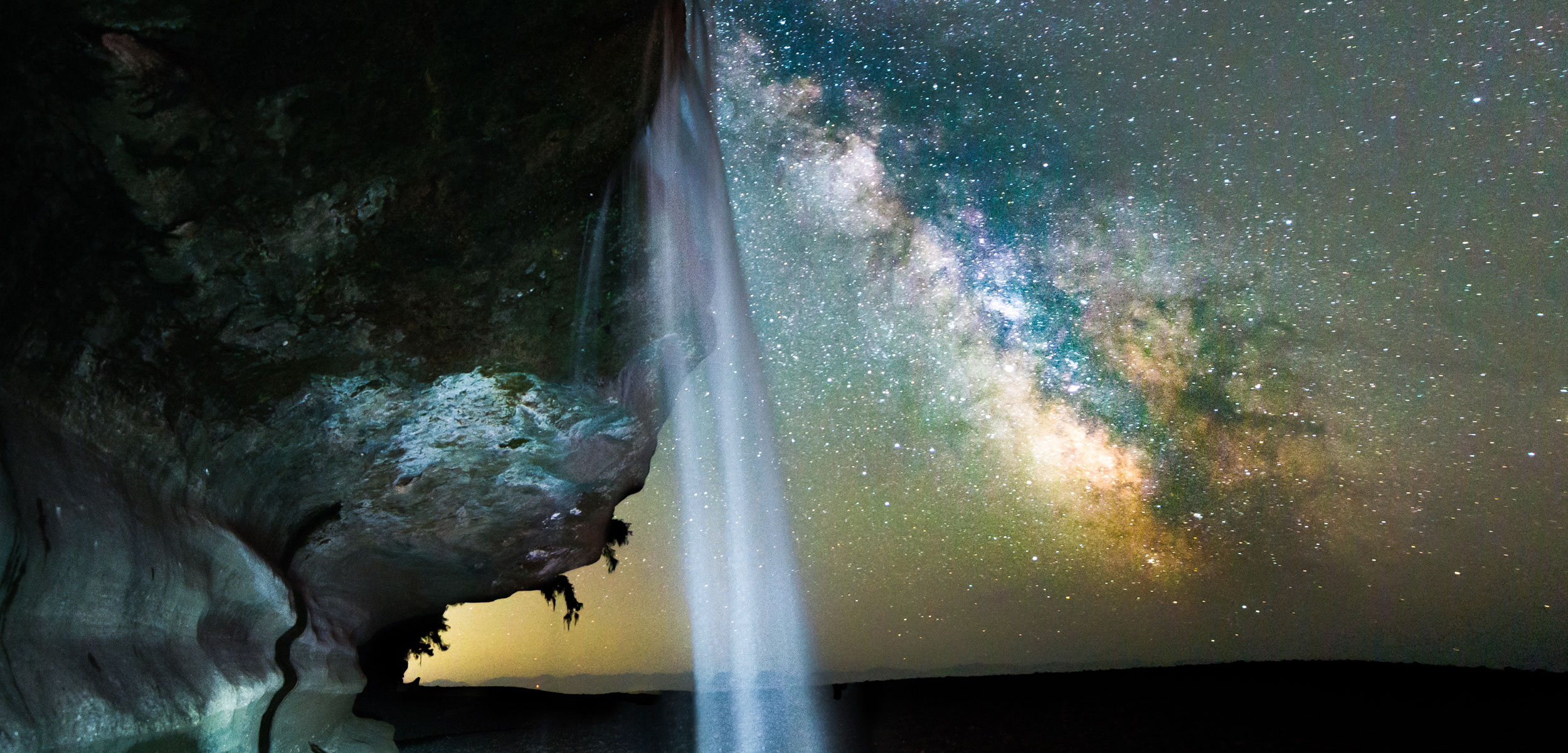milky way with waterfall