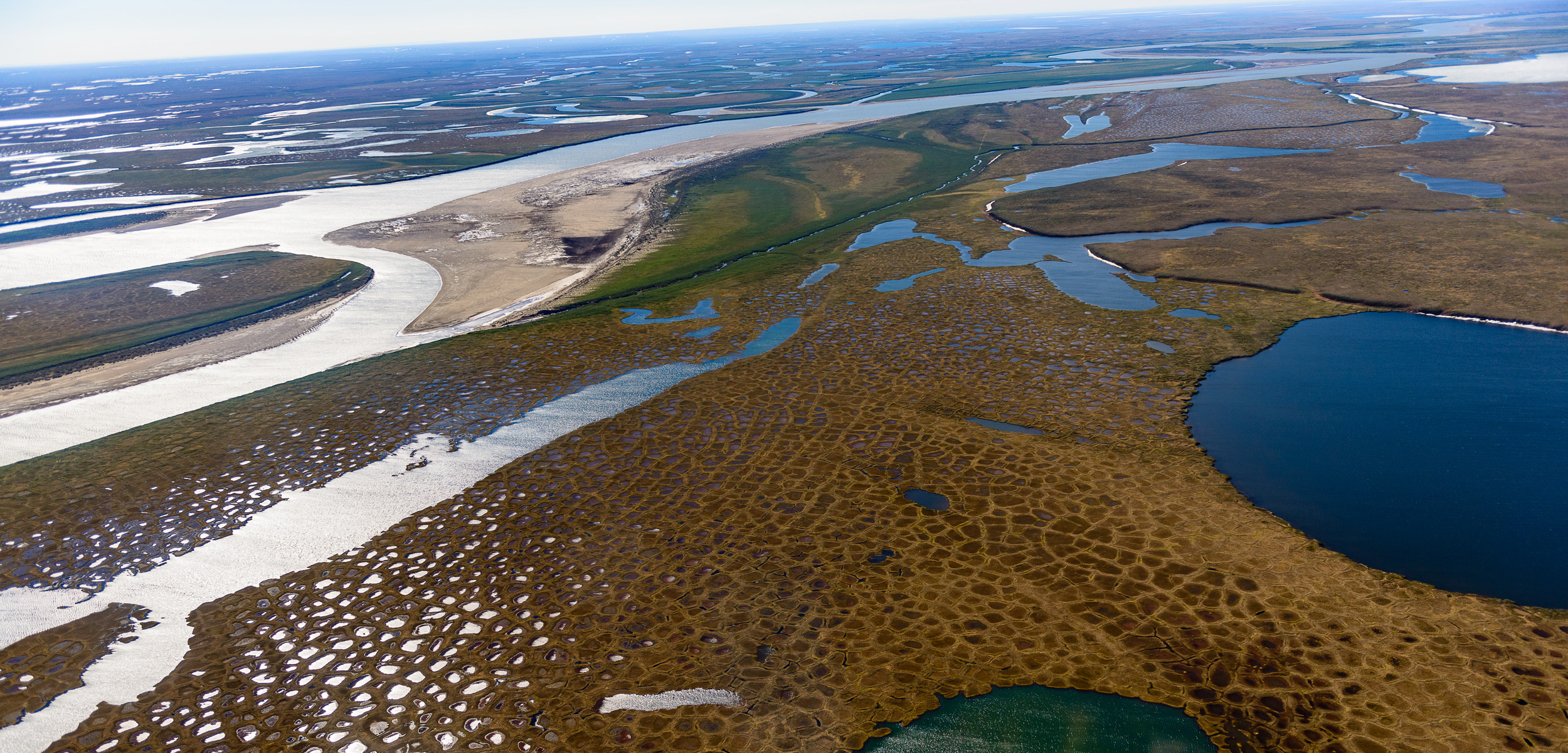 Thaw lakes and patterned ground surrounding the Colville River at the edge of the National Petroleum Reserve on Alaska’s North Slope. More than 40 percent of the carbon dioxide entering the atmosphere from the Arctic comes from its surface waters.