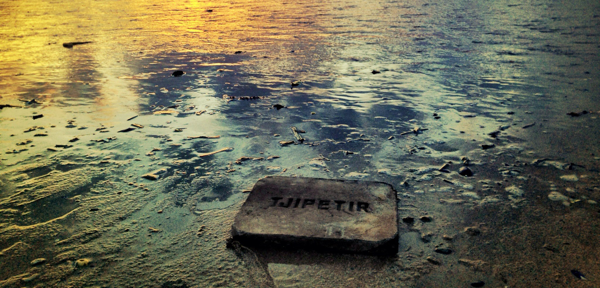 This rubbery block stamped with “Tjipetir” is one of many that have washed up on European beaches since 2012. Photo by Tom Quinn Williams/Tjipetir Mystery