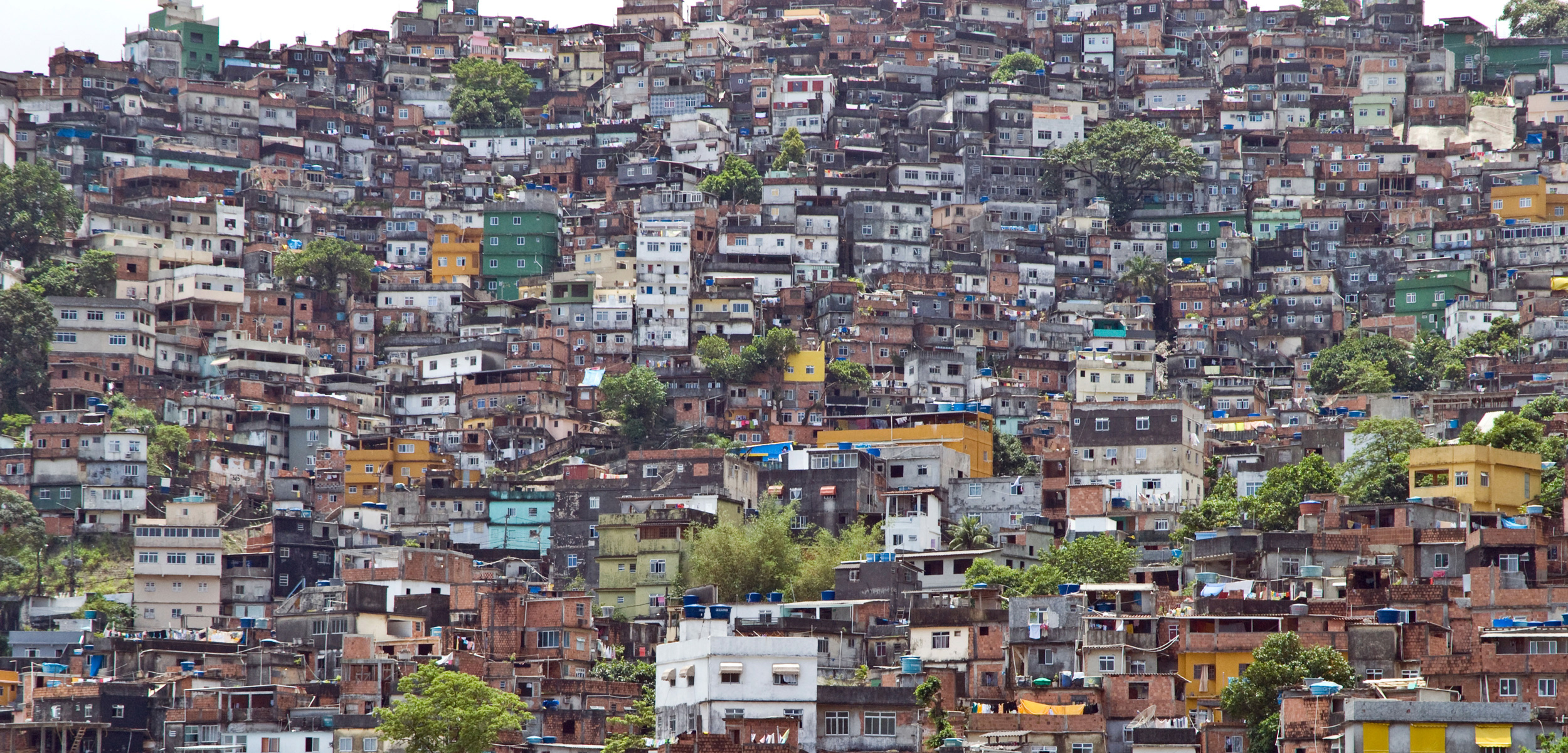 Favelas are the poor neighborhoods on the hillsides above the wealthy enclaves of old Rio de Janeiro. For the most part, residents of the favelas have been left out of the Olympic legacy. Photo by Simon Lowthian/Alamy Stock Photo