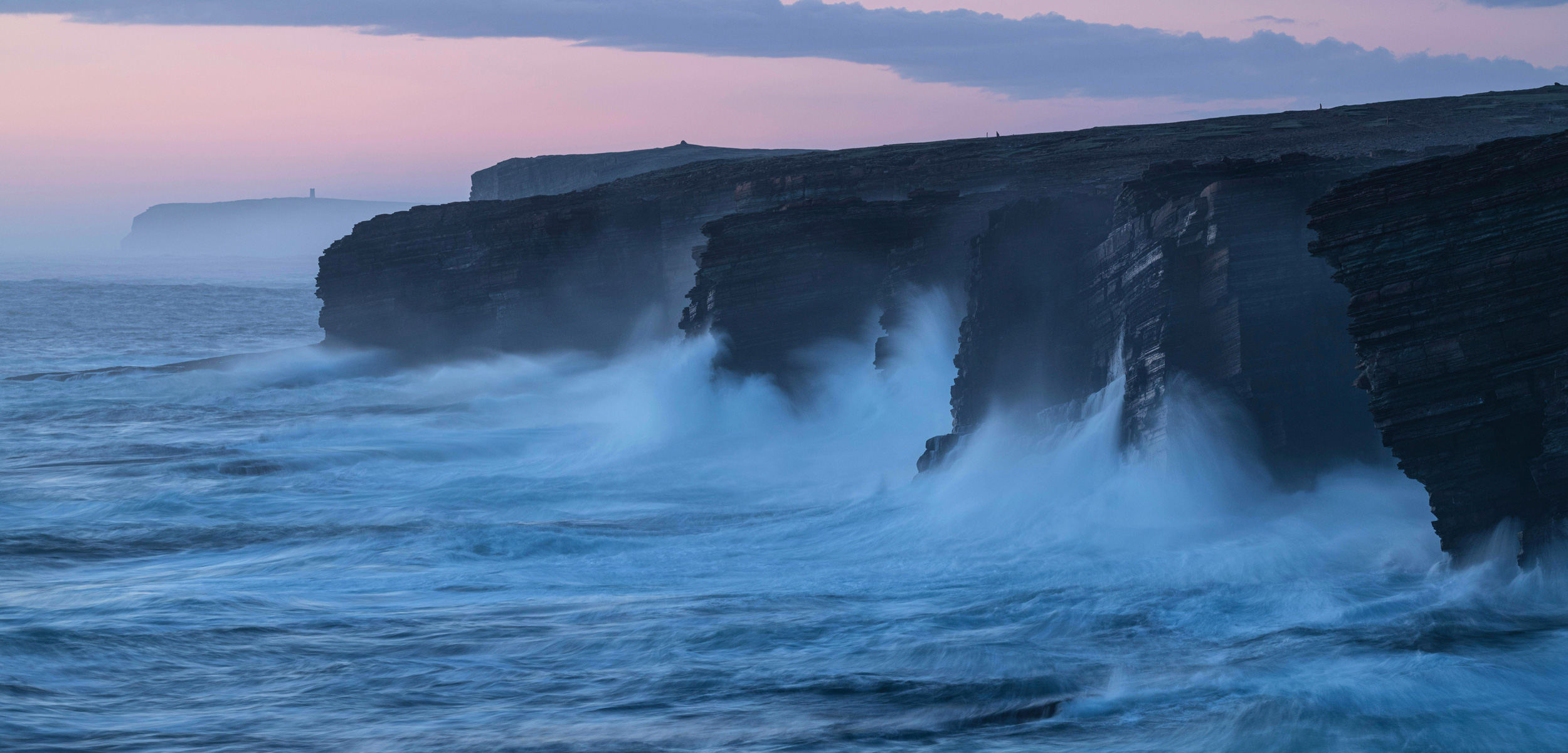 Waves crass against cliffs at Yesnaby, Orkney, Scotland