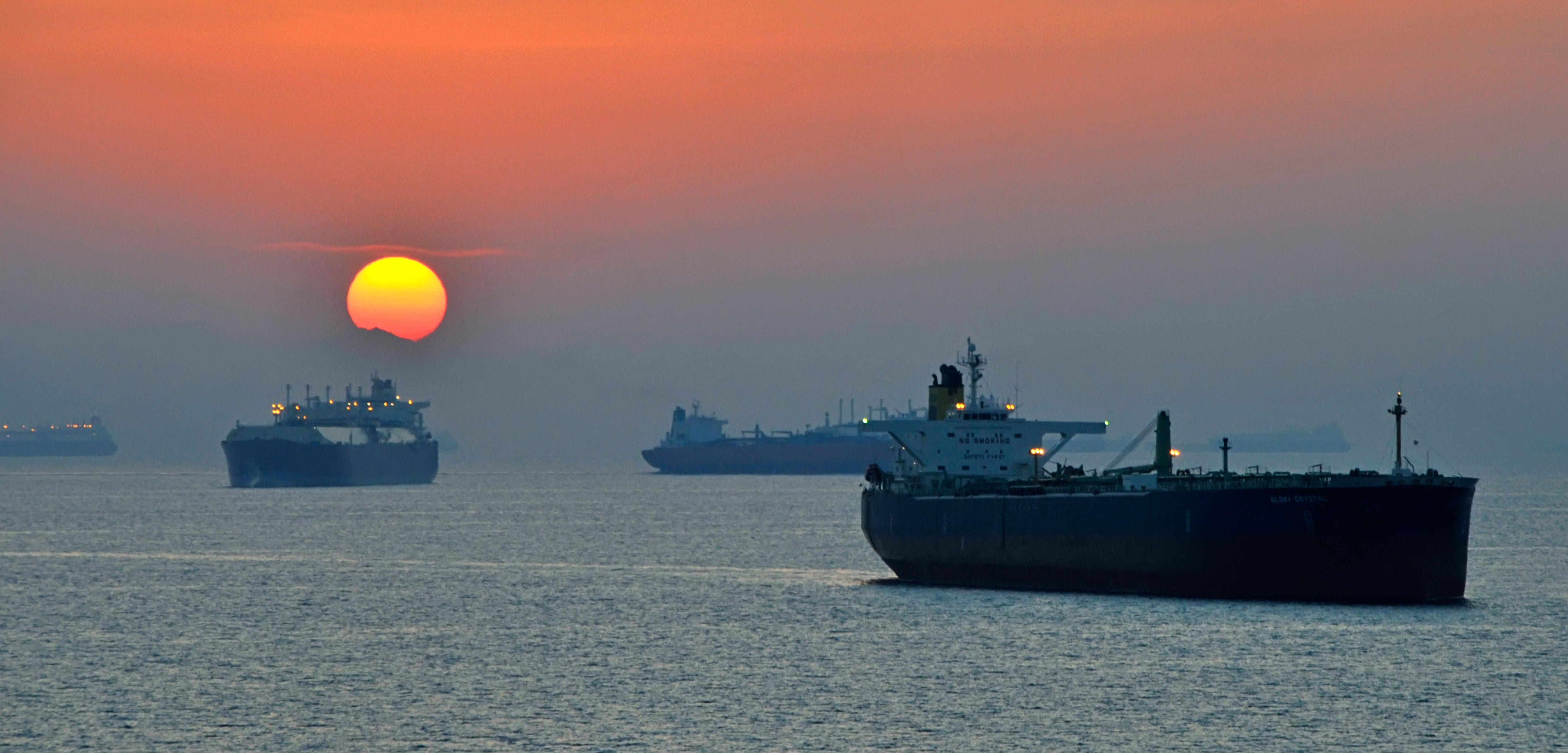 Ships off the coast of Fujairah in Gulf of Oman at sunset