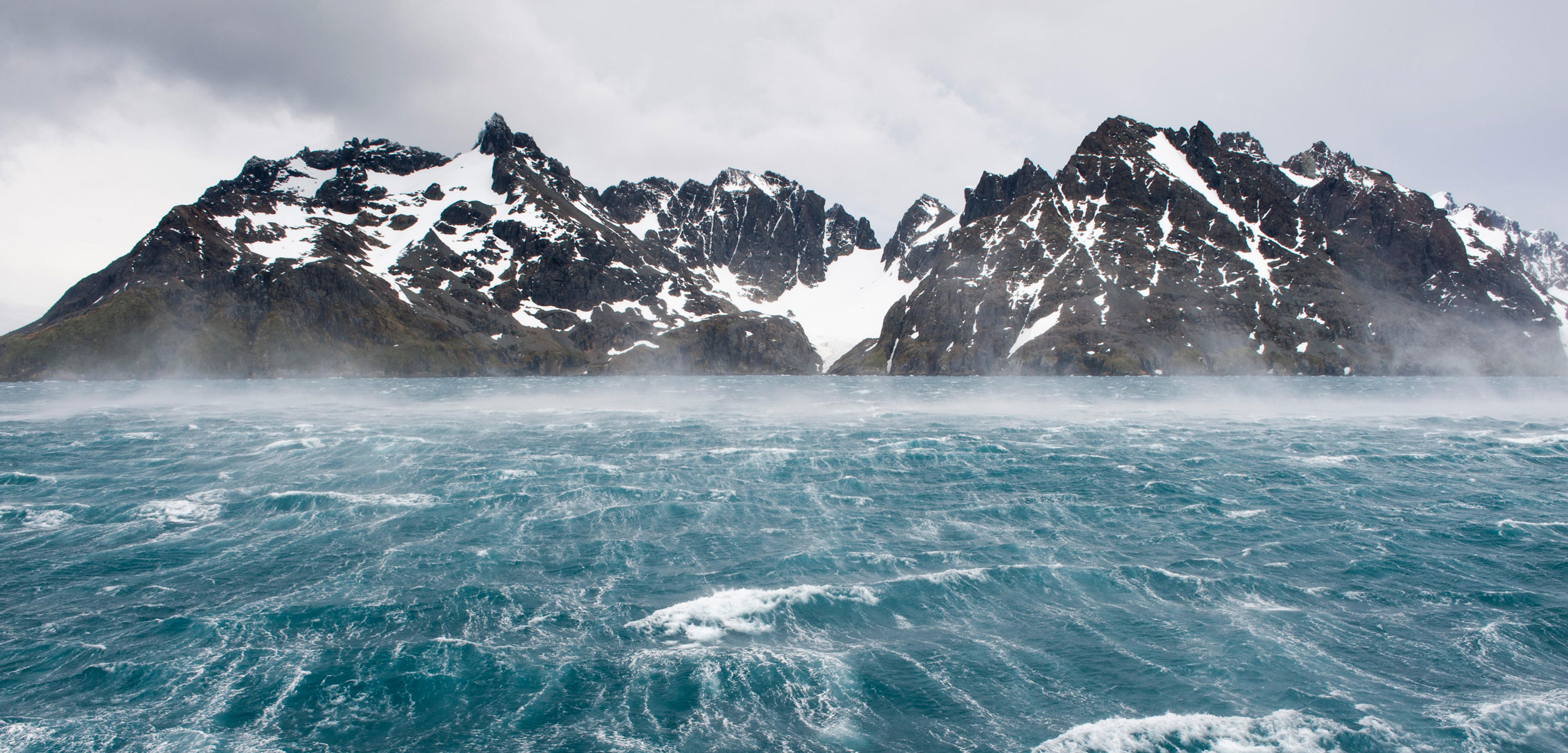 Stormy waters and rugged mountains, Drygalski Fjord, South Georgia Island, Antarctica