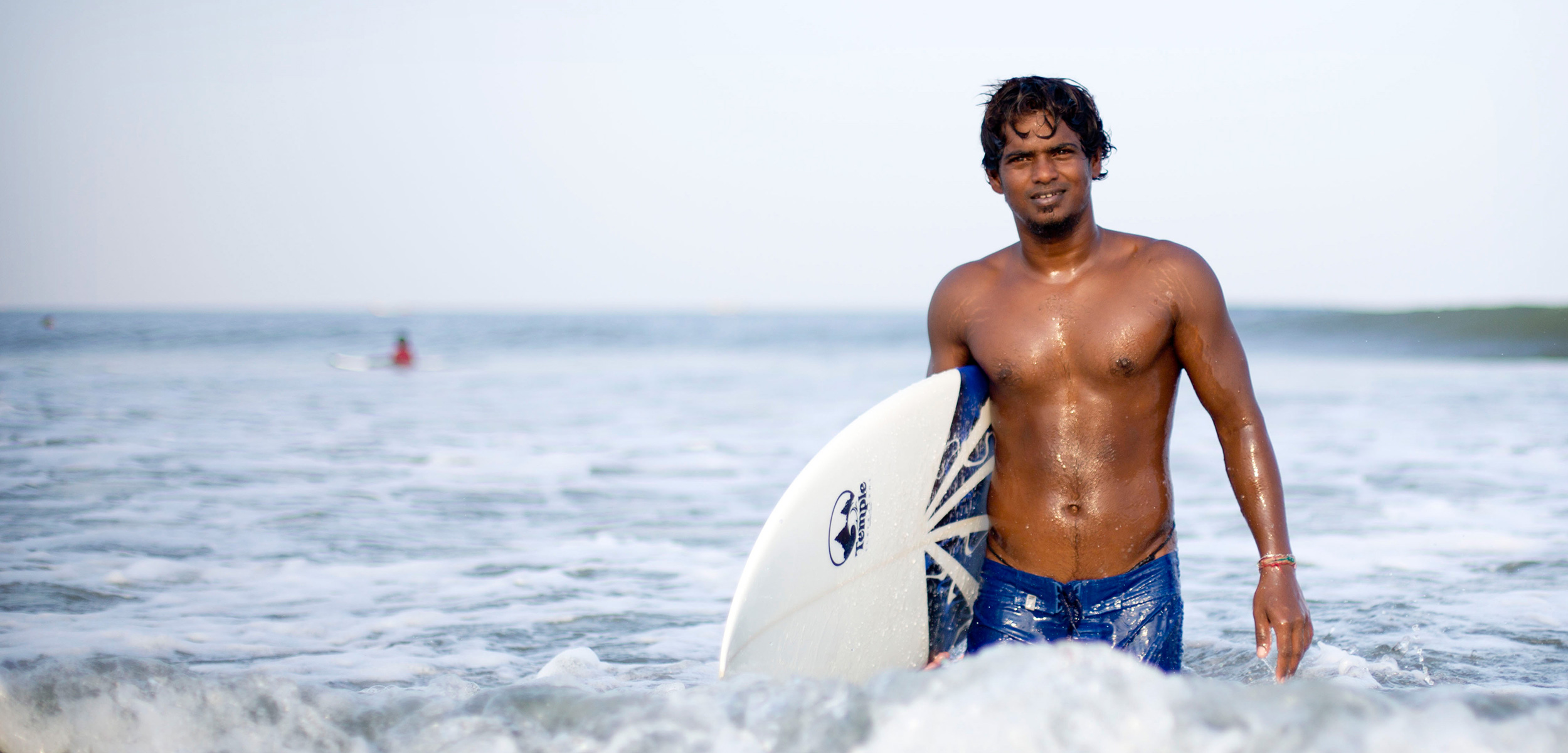 Santhosh Moorthi, fisherman, sculptor, surfer, and board shaper. Photo by Jyothy Karat