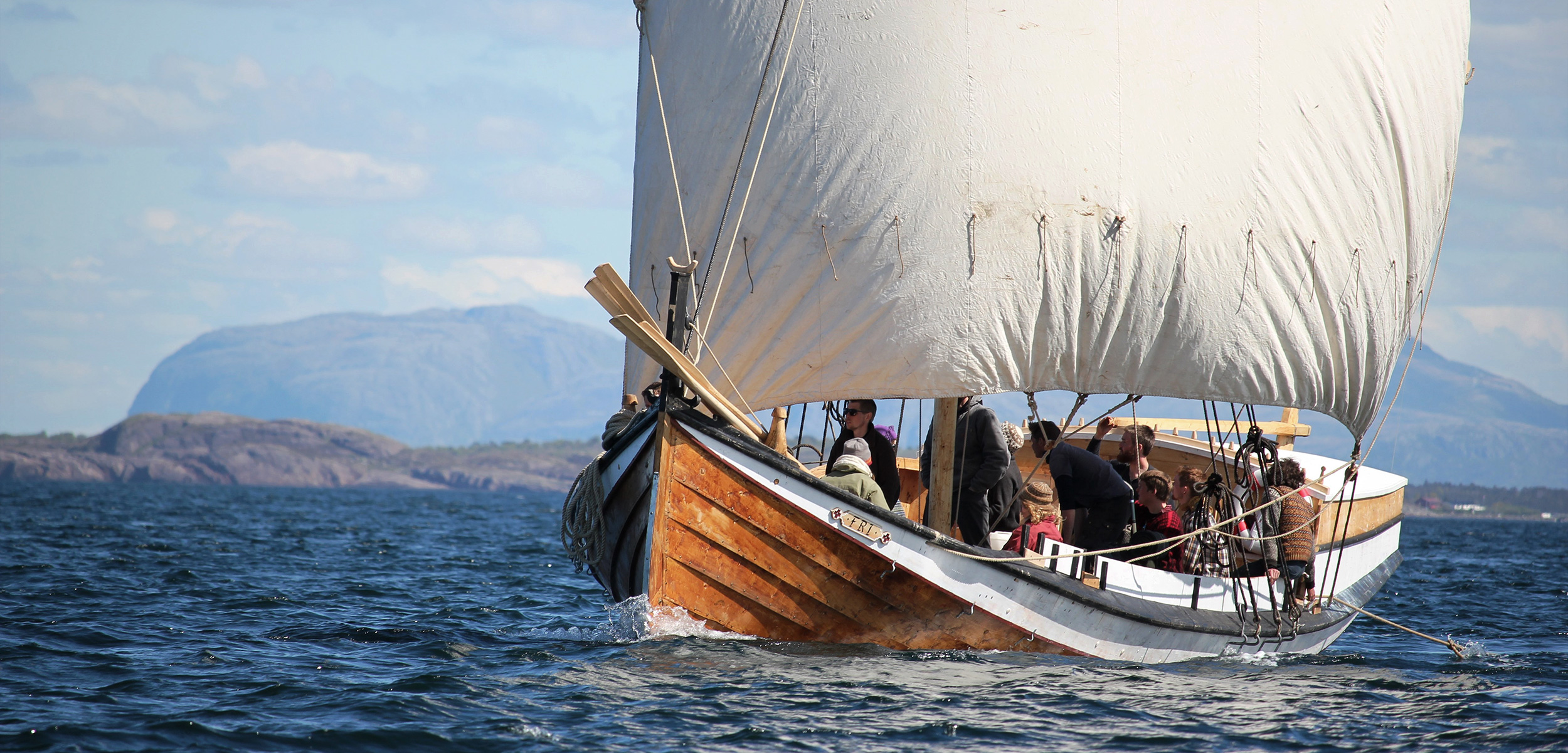 Fosen Folk High School students sailing a square-sail-rigged boat in the Trondheim Fjord. Square sails were the norm in Viking days. Photo by Claire Eamer