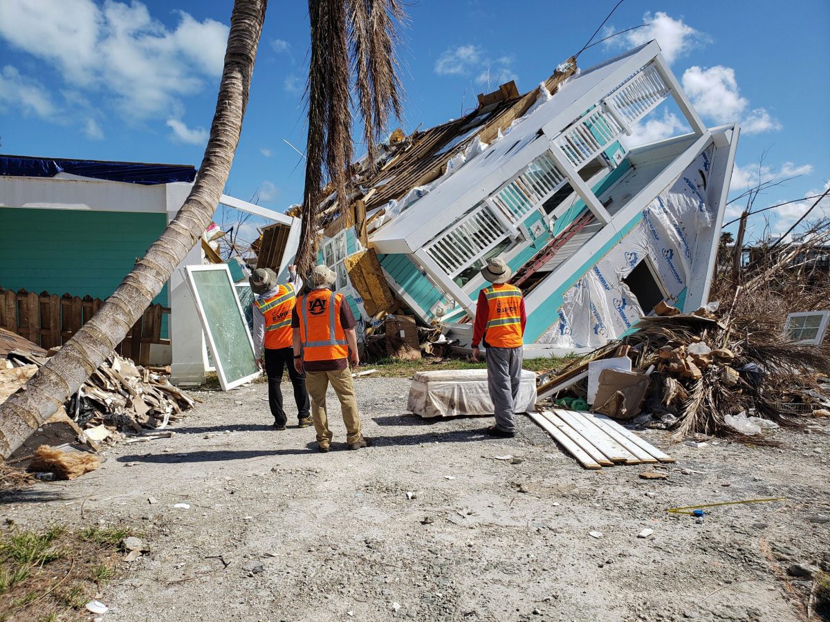 Engineers inspect a damaged building
