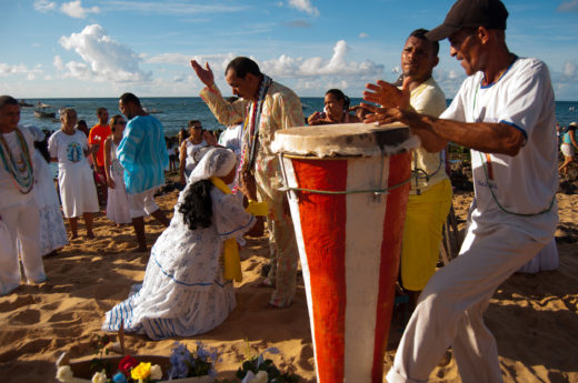 Music plays in Salvador while Brazilians make offerings to Iemanjá, the African goddess of the sea. Flowers and modern beauty luxuries are popular gifts. Photo by Alessandra Lori/Fotoarena/Corbis