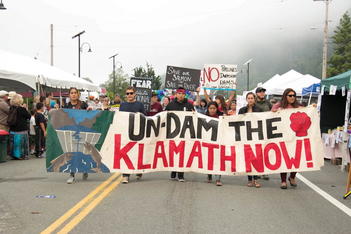 Wildfires make for a smoky backdrop as marchers kick off the 55th annual Klamath Salmon Festival with a parade in Klamath, California. Photo by Jolene Nenibah Yazzie/High Country News