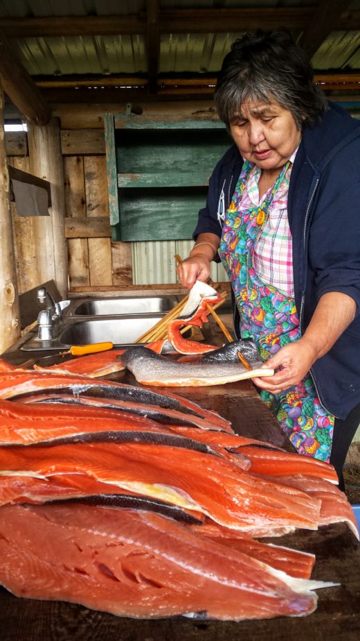 Haida elder Marina Jones preparing smoked salmon