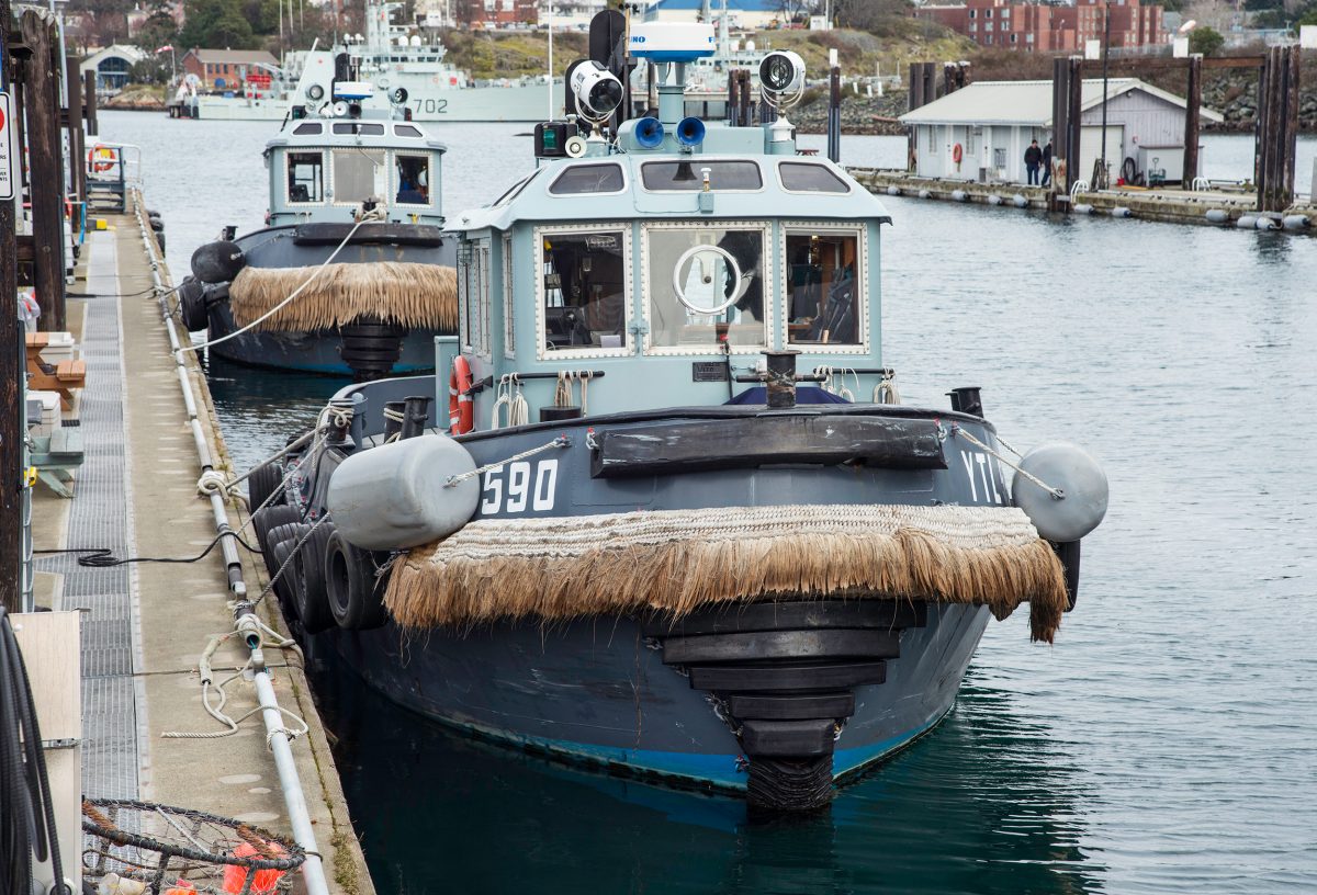 Canadian navy tugboats with rope fenders