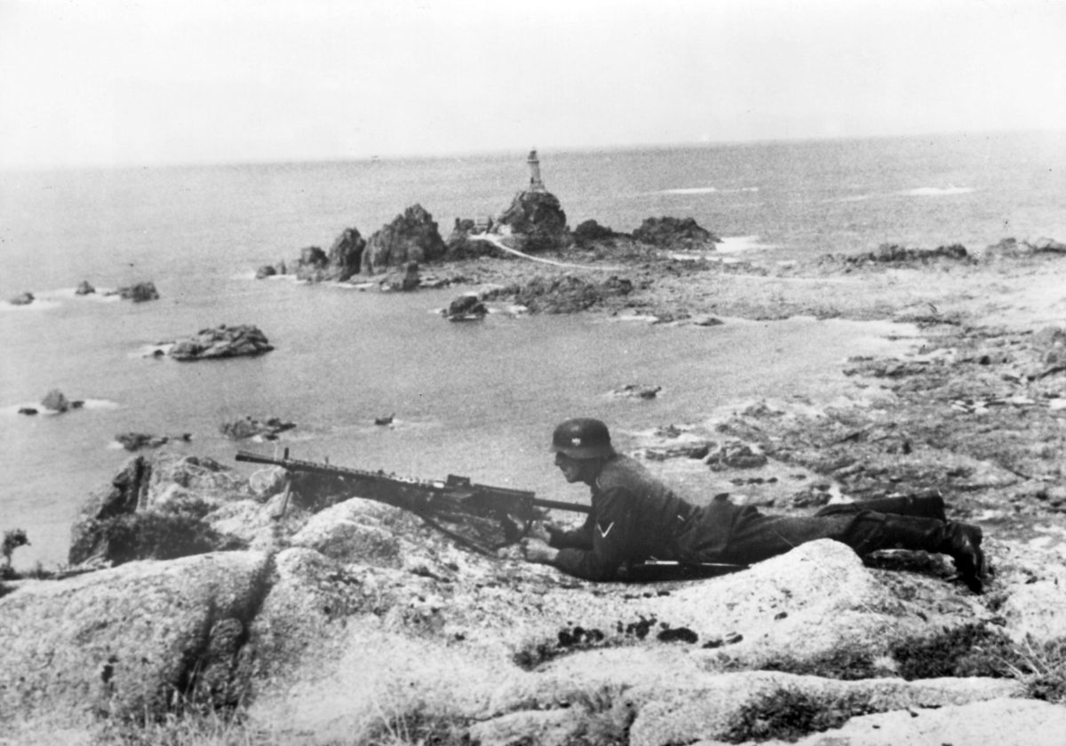  Nazi propaganda image depicts a guard soldier of the German Wehrmacht near La Corbière on the coast of the English Channel Jersey
