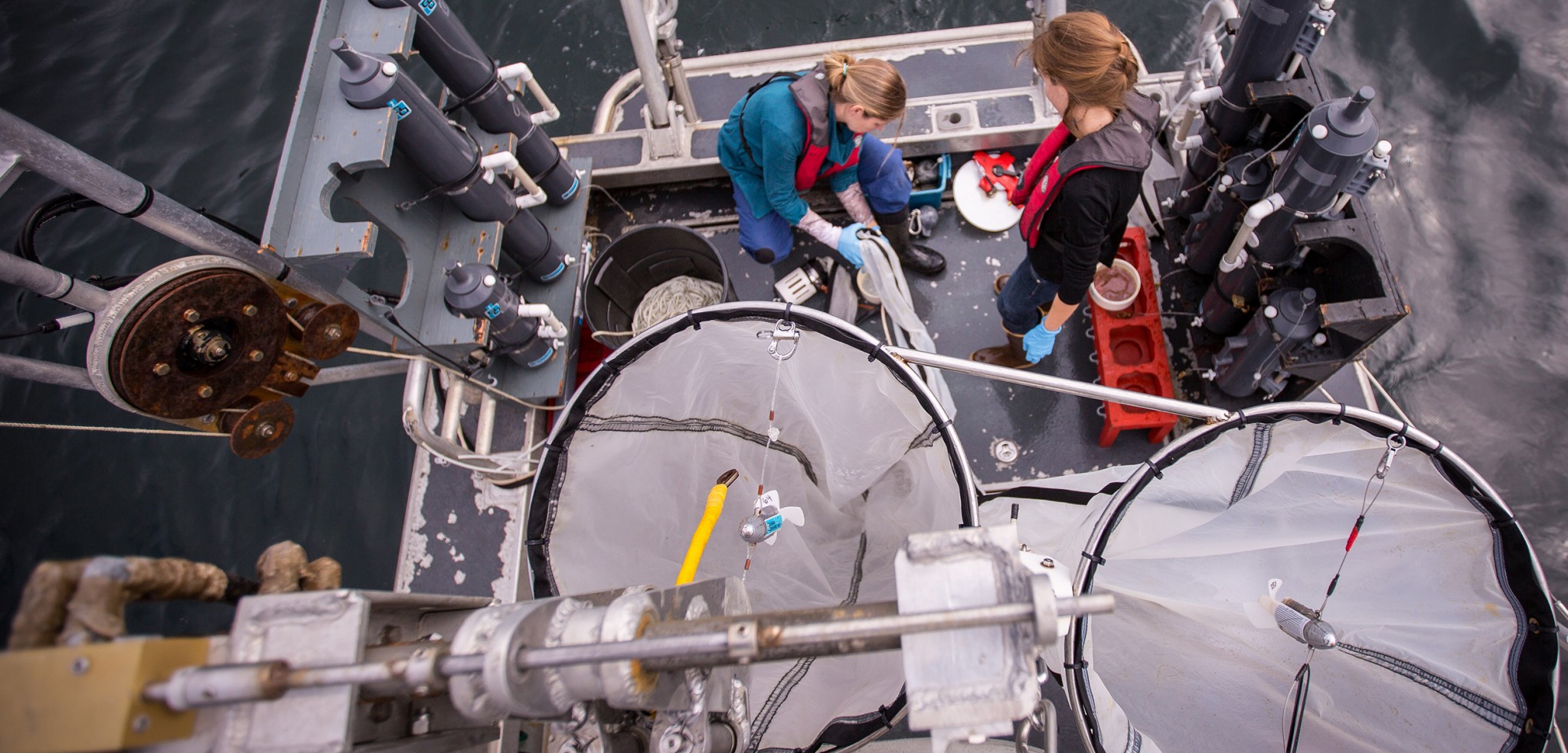 Hakai Institute researchers prepare nets for a plankton tow. Photo by Grant Callegari