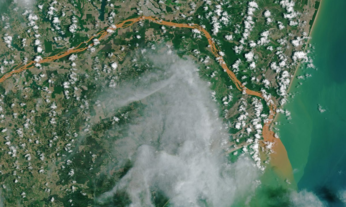 satellite image of mine tailings entering the ocean at the mouth of the Doce river