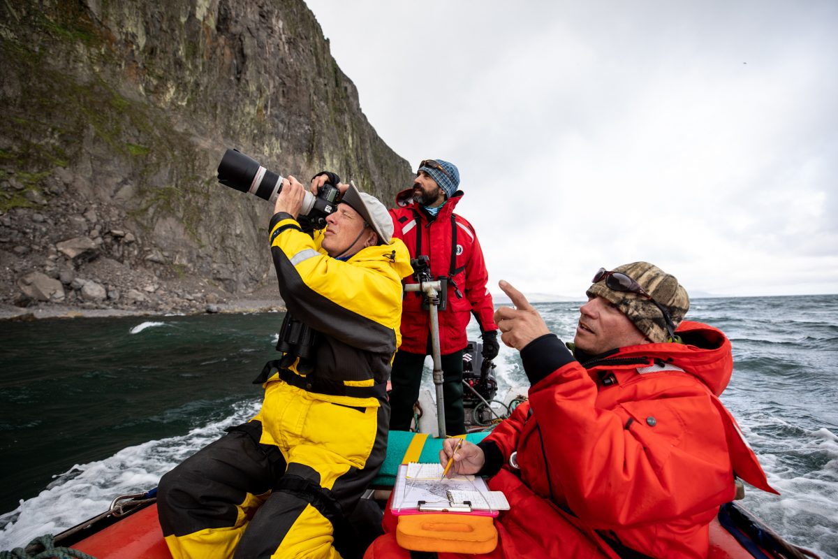 Aaron Christ (left), a biometrician for the Alaska Maritime National Wildlife Refuge; Marc Romano (center), biologist for the Bering Sea and Chukchi Sea units of the refuge; and Robb Kaler (right), a seabird biologist with the US Fish and Wildlife Service, count seabirds off St. Matthew Island. 