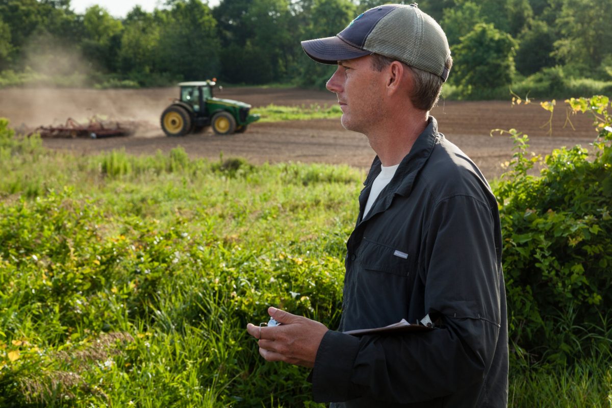 Ecologist Dan small surveys a farm