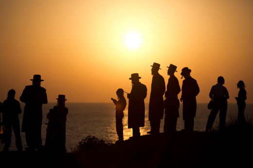 Ultra-Orthodox Jews perform the Tashlikh ritual on a beach in Herzliya, a city outside of Tel Aviv, Israel. Photo by Abir Sultan/epa/Corbis