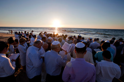 Jews recite prayers as part of the Tashlikh ceremony at sunset on the shores of the Mediterranean Sea in Ashdod, Israel. Photo by Jim Hollander/epa/Corbis