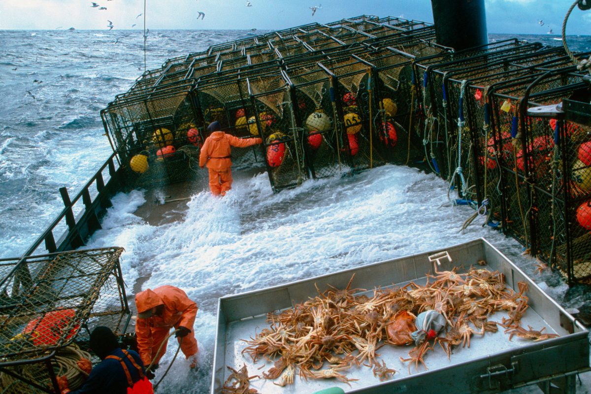 crabbers on deck in rough seas
