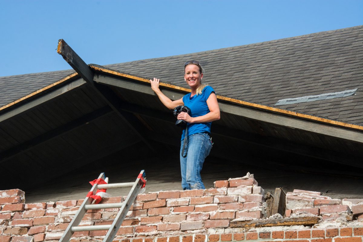 Jenny Wolfe inspecting the decking of the gable roof of the 1898 historic Waterworks pumping station